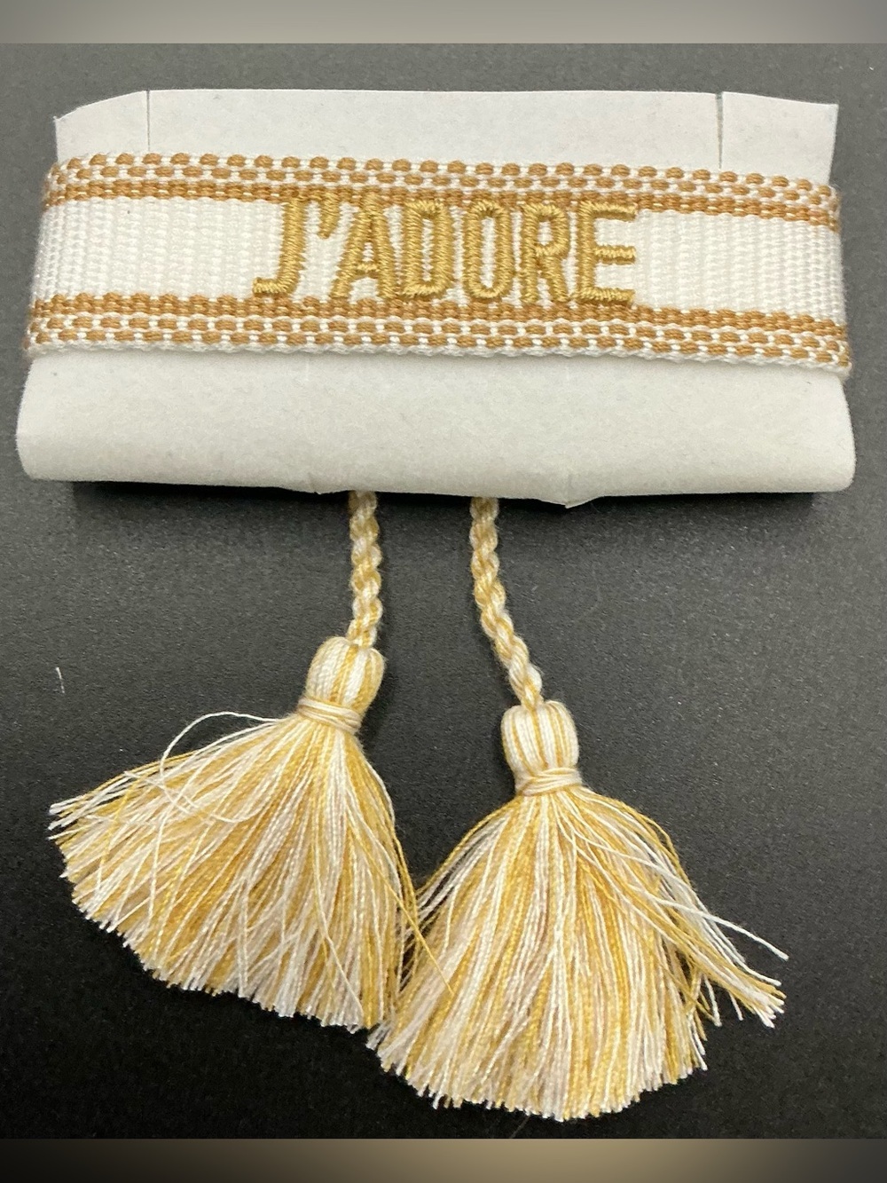 J’ADORE WHITE AND GOLD EMBROIDERED WOVEN TASSEL BRACELET